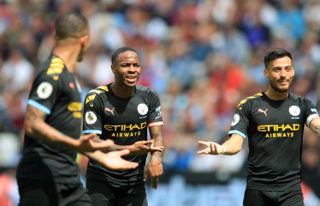 Raheem Sterling, centre, leads the protestations after VAR made its mark in the Premier League for the first time. Sterling's hat-trick helped get the reigning champions' title defence off to a flying start in a 5-0 success at West Ham but City were denied another goal when, on review, he was ruled offside by a matter of millimetres having assisted fellow forward Gabriel Jesus, left