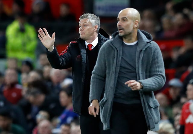 Manchester United manager Ole Gunnar Solskjaer (left)suggested Guardiola's side commit tactical fouls ahead of last season's derby