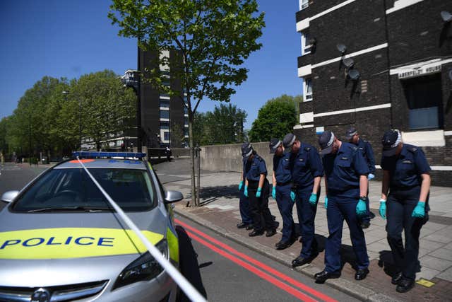 Police comb a cordoned area in south London after the shooting of 17-year-old Rhyhiem Ainsworth Barton (Victoria Jones/PA)