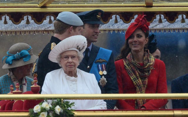 Queen with the Duke of Sussex and the Duke and Duchess of Cambridge on the royal barge Spirit of Chartwell during the Diamond Jubilee River Pageant. Adrian Dennis/PA Wire