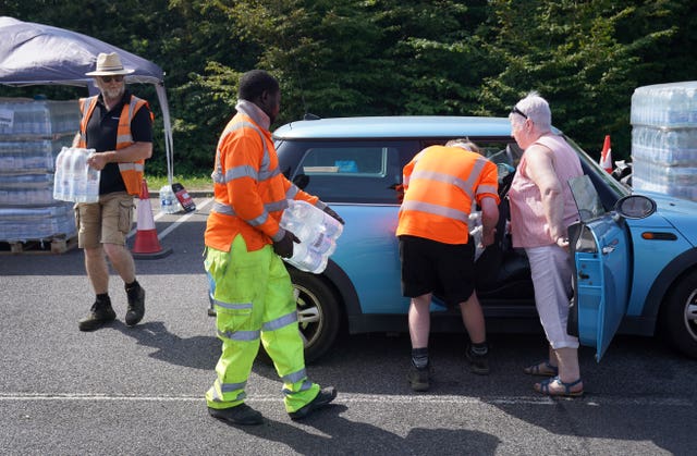 A woman at a water collection point near Herne Bay in Kent