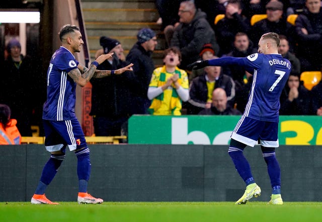 Watford's Gerard Deulofeu (right) celebrates scoring at Carrow Road