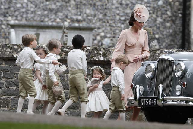 The Duchess of Cambridge with Prince George and Princess Charlotte at Pippa Middleton's wedding to James Matthews (Kirsty Wigglesworth/PA)
