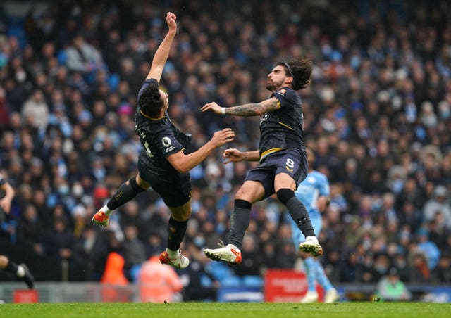 Max Kilman, left, and team-mate Ruben Neves clash heads