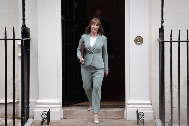 Rachel Reeves smiling while exiting 11 Downing Street