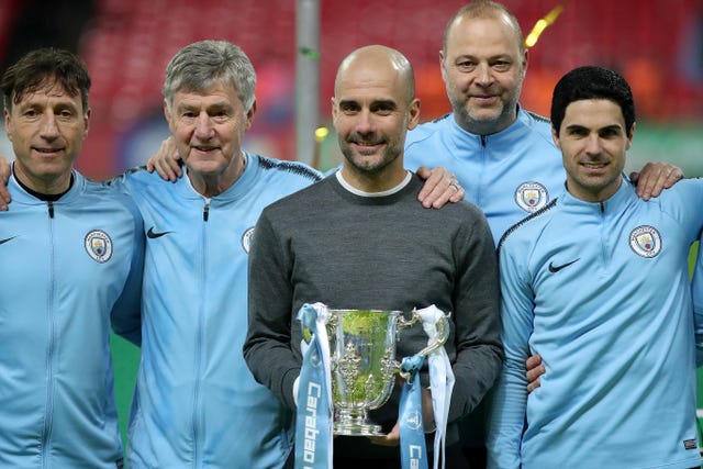 Pep Guardiola and his backroom staff celebrate with the Carabao Cup last season