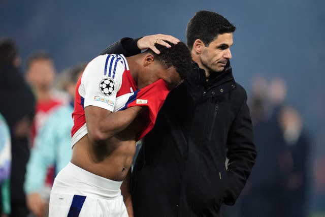 Arsenal manager Mikel Arteta (right) consoles player Jurrien Timber