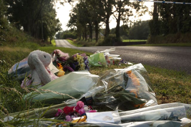 Flowers and a teddy bear laid close to the scene of a triple shooting on Wednesday in Drummeer Road in Maguiresbridge, Co Fermanagh