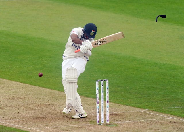 Cheteshwar Pujara is struck on the helmet by Neil Wagner