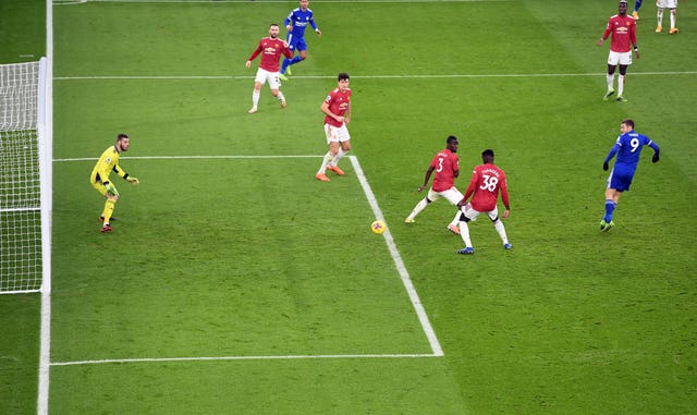 Axel Tuanzebe, centre right, deflects Jamie Vardy's shot into his own goal