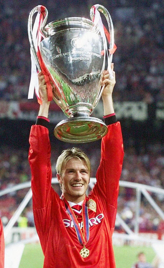 David Beckham lifts the Champions League trophy above his head after Manchester United's victory in the 1999 final