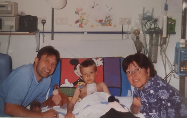 Tommy Frank with his parents Christine and Kevin