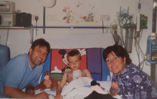 Tommy Frank with his parents Christine and Kevin 