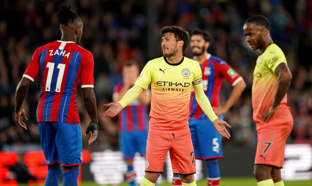David Silva exchanges words with Crystal Palace’s Wilfried Zaha 