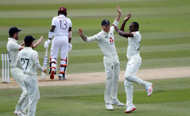 England's Jofra Archer, right, celebrates taking the wicket of West Indies' Shamarh Brooks 