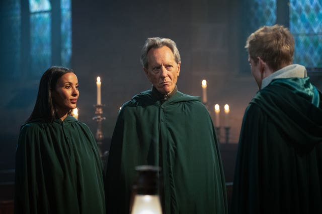 Richard E Grant, Maya Jama and James Acaster in The Celebrity Traitors