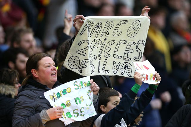 A fan holds up a sign reading 'Marco 2 pieces of Silva' on the Everton manager's return to Watford