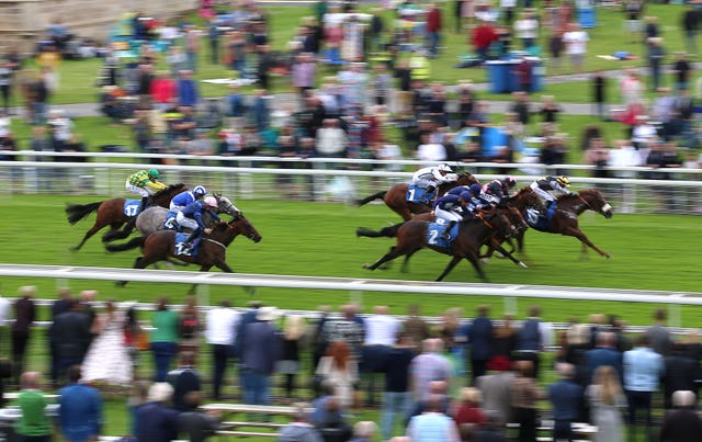 Flaming Rib ridden by jockey Pierre-Louis Jamin (third right, number 2) winning the Sky Bet Nursery rat York