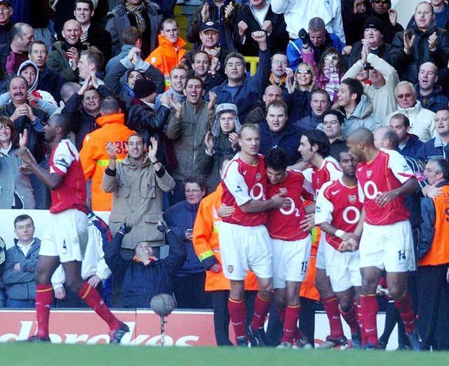 Robert Pires, third right, celebrates his goal