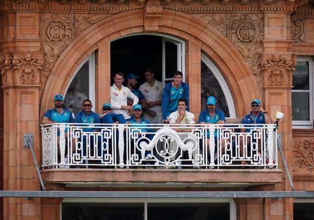 Australia players watch from the Lord's balcony during their team's second innings