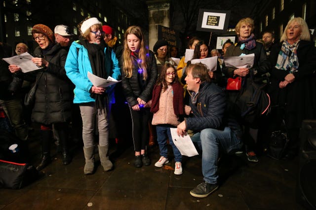 Richard Ratcliffe, kneeling next to his daughter Gabriella outside Downing Street