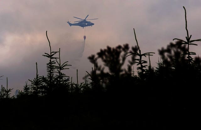 Members of the Irish Air Corps help tackle the wildfire