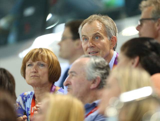 Dame Tessa Jowell (left) sits next to former prime minister Tony Blair during the evening swimming session at the Aquatics Centre in the Olympic Park, London, on the seventh day of the London 2012 Olympics. (Mike Egerton/PA)