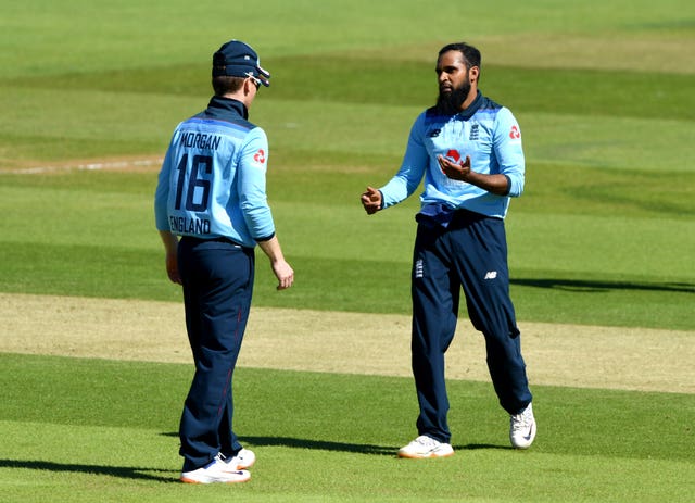 Adil Rashid, right, celebrates with captain Eoin Morgan after taking the wicket of Ireland’s Kevin O’Brien