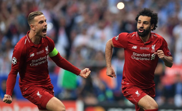 Henderson, left, celebrates with Mohamed Salah after the opening goal