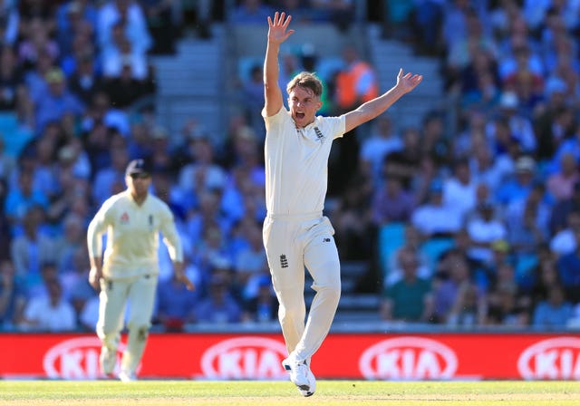 Sam Curran, pictured, and Woakes are vying for one place in England's bowling attack