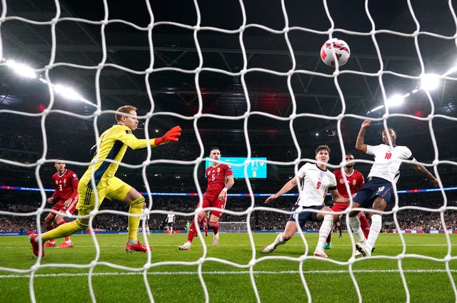 John Stones, second right, scores England’s goal