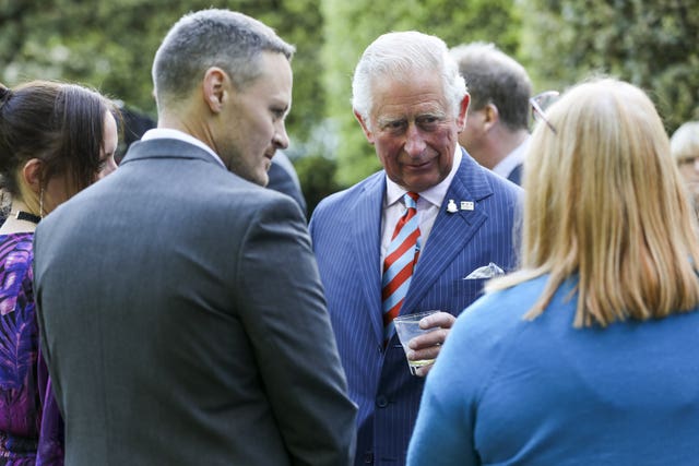 The Prince of Wales meets veteran Dean Porter during the receptio