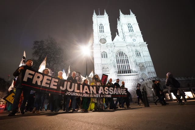 Campaigners pressing for the release of WikiLeaks founder Julian Assange take part in a demonstration during a Night Carnival outside Westminster Abbey in London. 