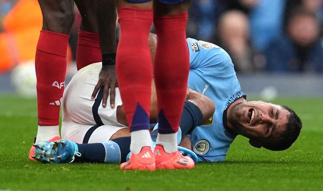 Manchester City’s Rodri lies in pain after suffering an injury during a game