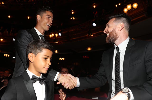 Lionel Messi greets Cristiano Ronaldo, left, at 2017's The Best FIFA Football Awards