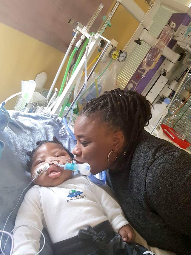 Isaiah Haastrup with his aunt Dahlia Thomas (Family handout/Irwin Mitchell/PA)