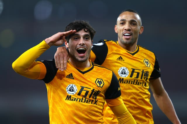 Pedro Neto (left) celebrates scoring his side’s first goal