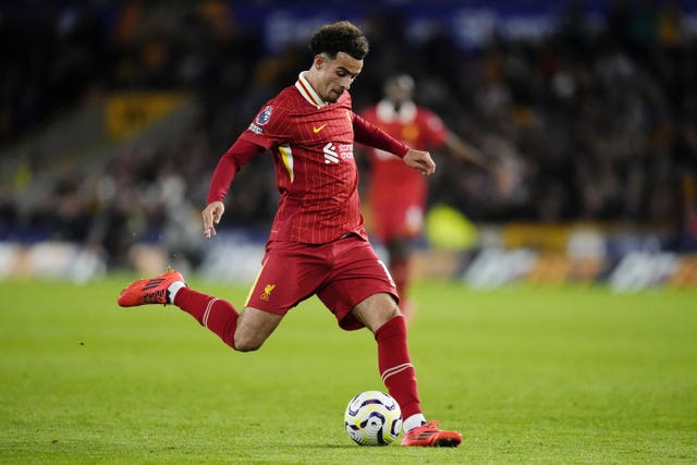 Liverpool midfielder Curtis Jones kicks a ball