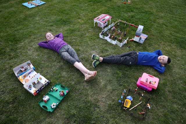 Ailie and Hamish Muirhead beside their toy recreation of the Royal Highland Show