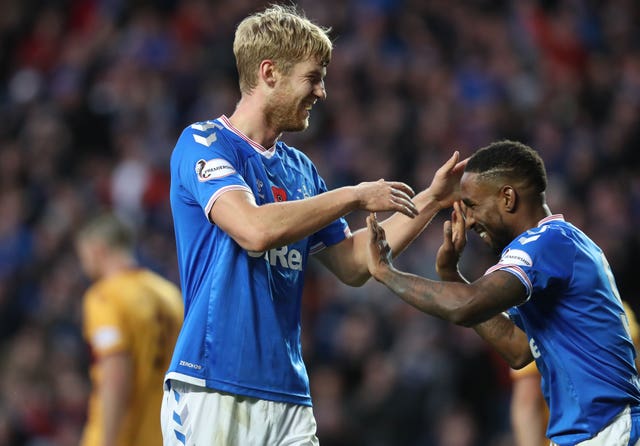 Filip Helander, left, celebrates his winner 