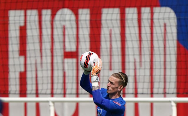 England’s Jordan Pickford catches the ball during a training session at St George’s Park, Burton-upon-Trent.
