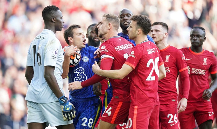 Captains Cesar Azpilicueta, second left, and Jordan Henderson, third left, clash following Liverpool’s equaliser