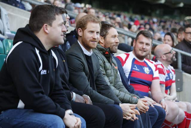 Prince Harry (centre left) with former England player Jonny Wilkinson (centre right) during a visit to the England rugby team open training session at Twickenham Stadium in London. (Heathcliff O’Malley/The Daily Telegraph)