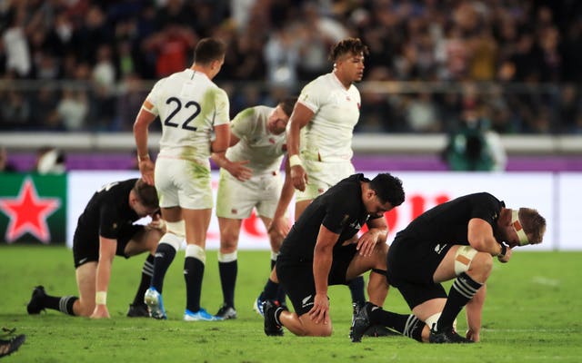 New Zealand players drop to their knees at the full-time whistle
