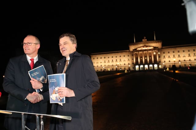 Simon Coveney and Julian Smith outside Stormont
