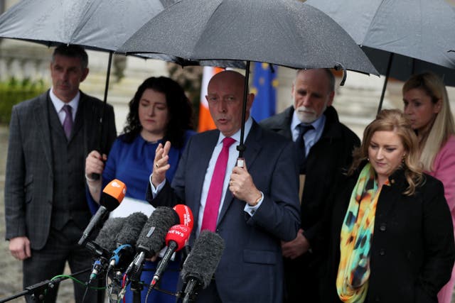 Peter Sheridan (centre) speaking to the media following a meeting with the chancello