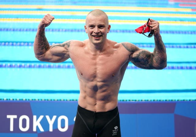 Adam Peaty reacts after his victory