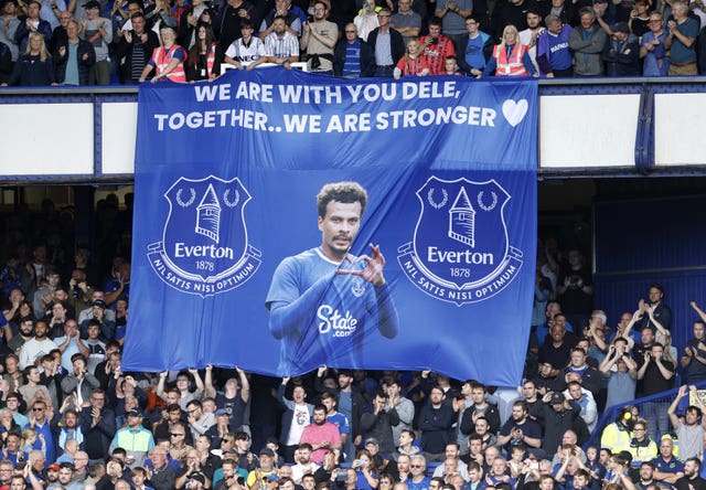 Everton fans hold a banner in support of Dele Alli