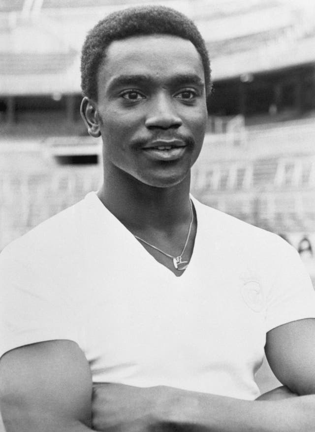 Laurie Cunningham, wearing a Real Madrid short, folds his arms for a photoshoot after signing for the club
