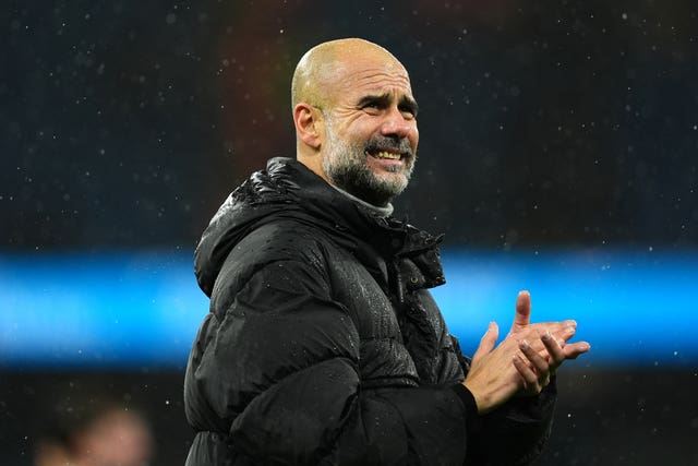 Manchester City manager Pep Guardiola acknowledges the fans